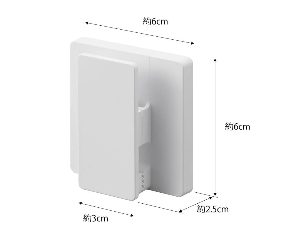 MISTフィルムフック ワイドクリップ2個組が光沢のある平らな壁面に取り付けられている様子