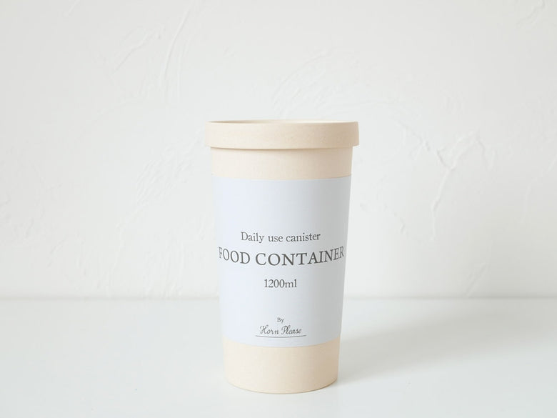 志成販売のHorn Please ECOキャニスター、アイボリー色の1200mlサイズと蓋が写った商品画像