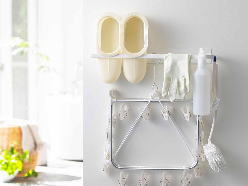 タワーのマグネット付き2段洗濯ハンガー収納ラック。スチール製で壁面に取り付け可能、洗濯物や小物を整理します。