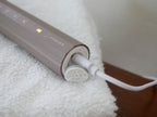 エペイオスの音波電動歯ブラシ本体、専用携帯用ケース、替えブラシヘッドがセットされた商品画像