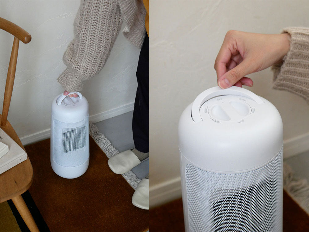 スリーアップのハンドル付き首振りセラミックファンヒーターと幼児がいるリビングルームの様子