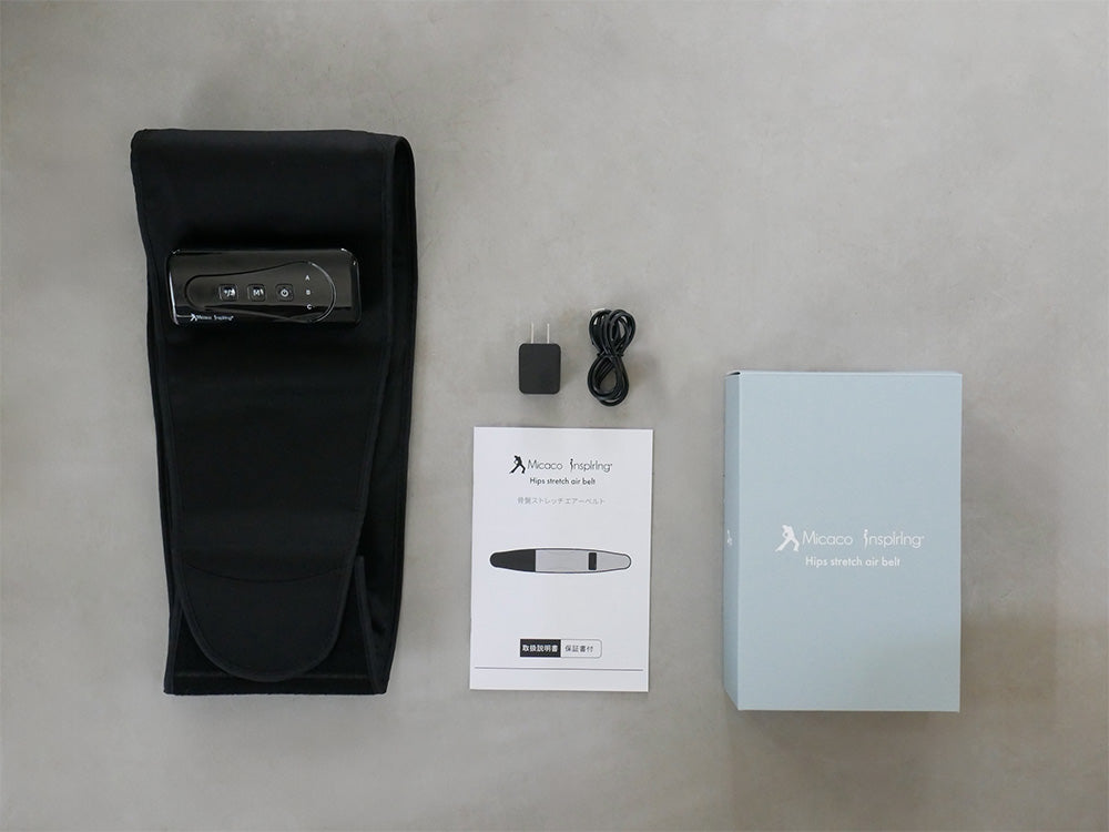 銀色のプラスチック製コントローラーとポリエステルベルトを備えたMicaco骨盤ストレッチエアーベルトの画像