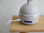 フェスティノの充電式EMSヘッドスパプレミアホワイトモデル、コンパクトなプラスチック製電子デバイス