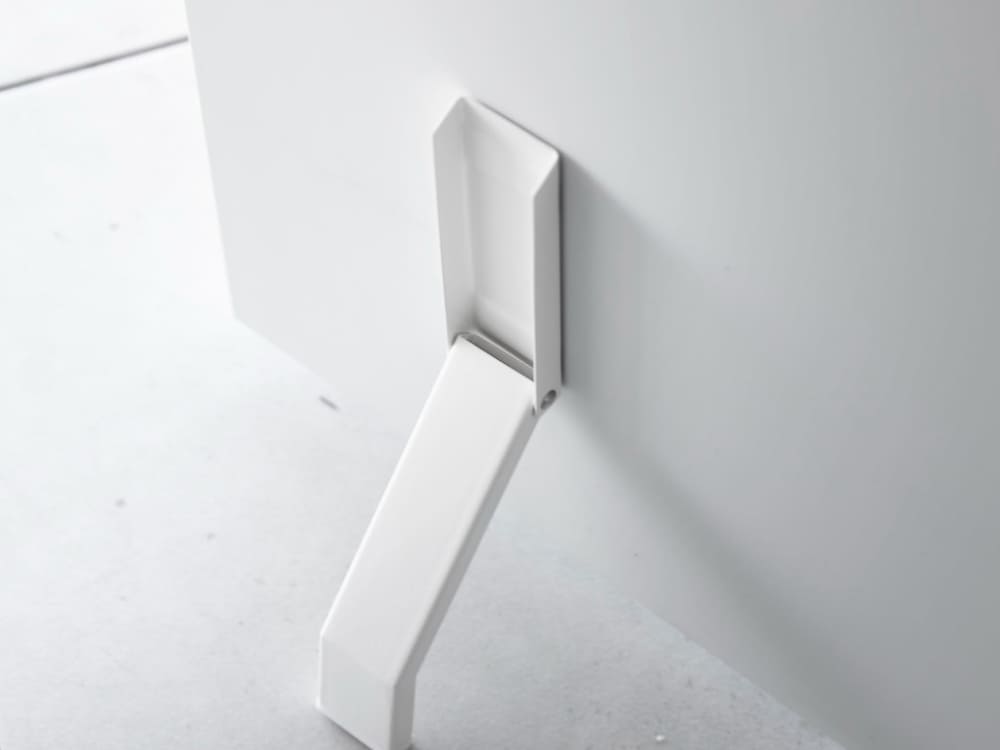 タワーの銀色スチール製マグネット折り畳みドアストッパーの実物写真、シリコーン滑り止め付き